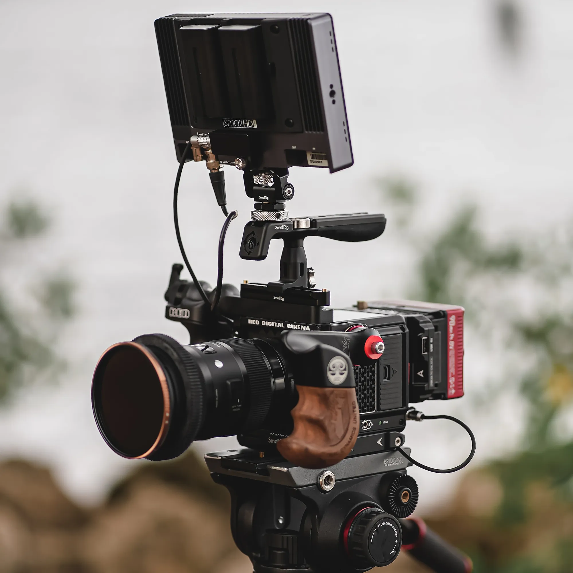 A RED cinema camera built out on a tripod